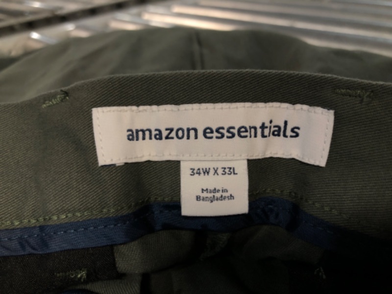 Photo 2 of **SEE NOTES**  Amazon Essentials Men's Slim-Fit Casual Stretch Khaki Pant Green, SIZE: 34W X 33L