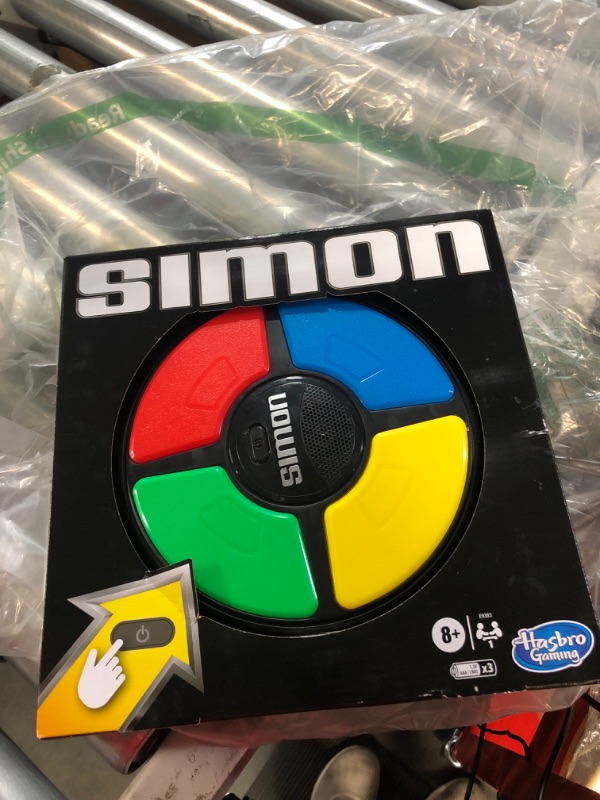 Photo 2 of *NOT TESTED** Hasbro Gaming Simon Handheld Electronic Memory Game With Lights and Sounds for Kids Ages 8 and Up