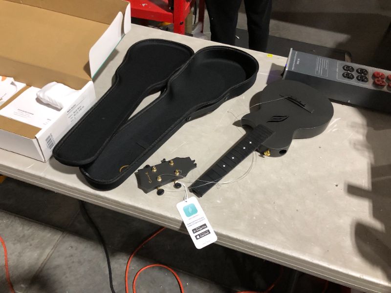 Photo 2 of ***MAJOR DAMAGE - HEAD AND STRINGS BROKEN OFF - SEE PICTURES***
Enya Concert Ukulele Nova U 23’’ Carbon Fiber Travel Ukulele, Black