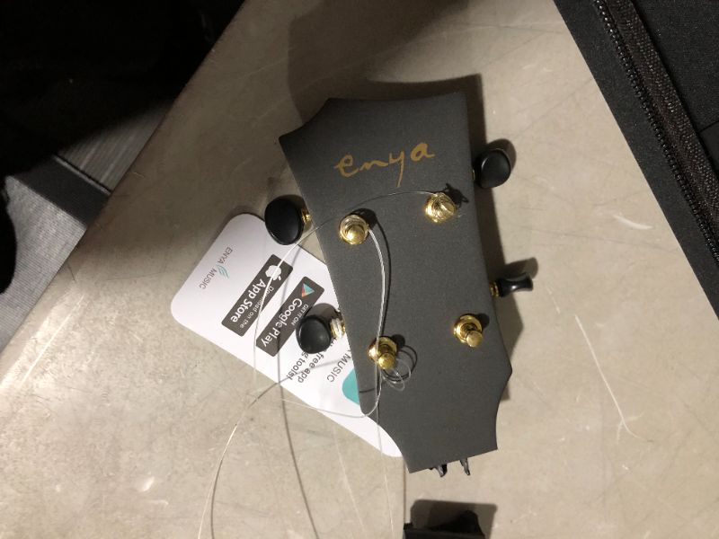 Photo 4 of ***MAJOR DAMAGE - HEAD AND STRINGS BROKEN OFF - SEE PICTURES***
Enya Concert Ukulele Nova U 23’’ Carbon Fiber Travel Ukulele, Black