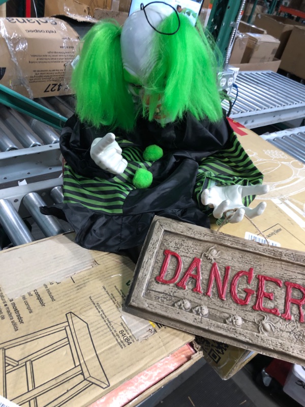 Photo 1 of Haunted Hill Farm Talking, Shaking, Mini Animatronic Clown with Light-Up Eyes and Danger Sign for Battery Operated Scary Indoor or Covered Outdoor Halloween Decoration 30" Shaking Clown
