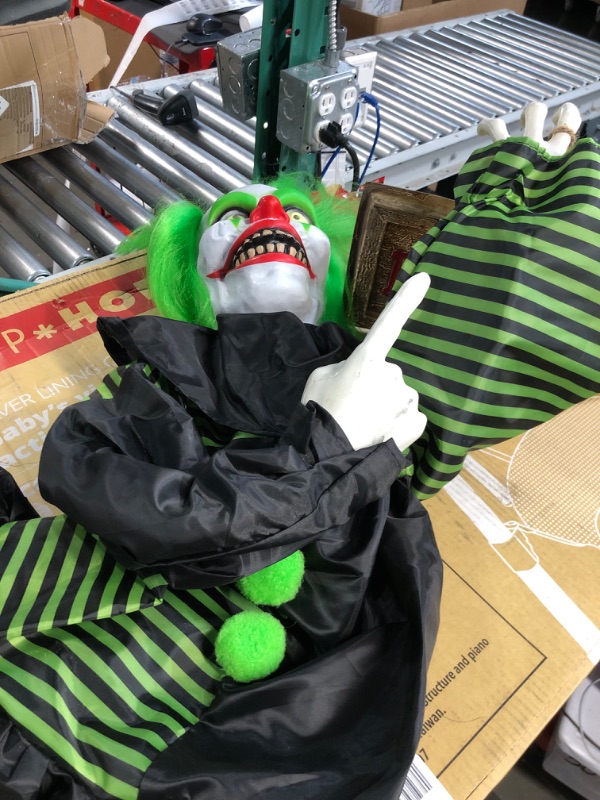 Photo 2 of Haunted Hill Farm Talking, Shaking, Mini Animatronic Clown with Light-Up Eyes and Danger Sign for Battery Operated Scary Indoor or Covered Outdoor Halloween Decoration 30" Shaking Clown