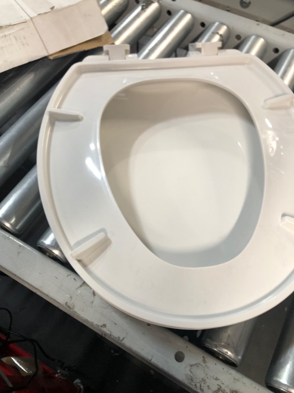 Photo 2 of **SEAT ONLY NO HARDWARE**Project Source Plastic White Round Soft Close Toilet Seat