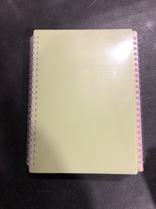 Photo 1 of 4 pack of colored spiral notebooks. 