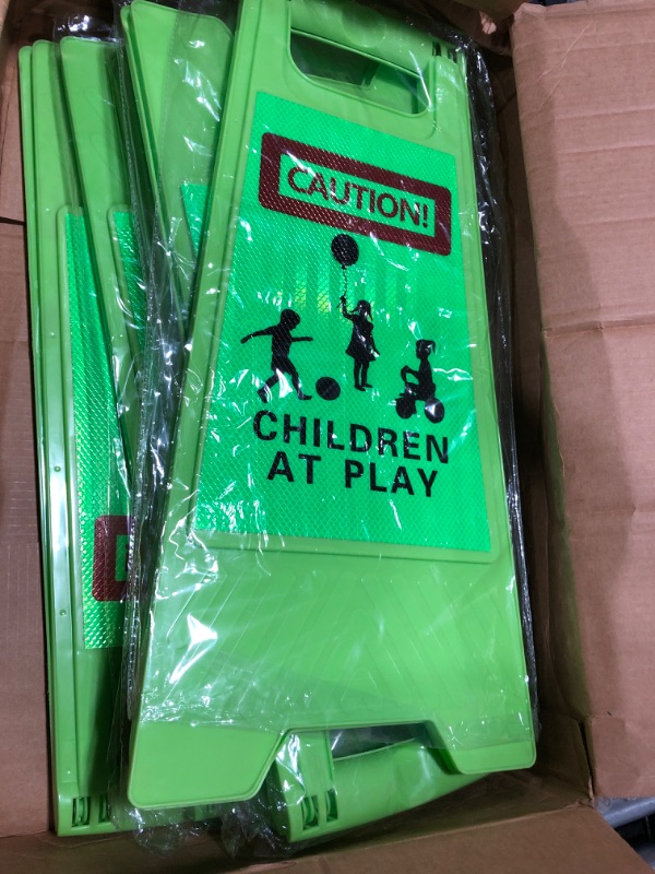 Photo 2 of Double Sided Green Reflective Caution Kids Playing Sign Bulk Children At Play Safety Signs for Street Kids Playing Warning Sign Caution Slow Down Board Sign for Neighborhood Driveway (6 Pieces)