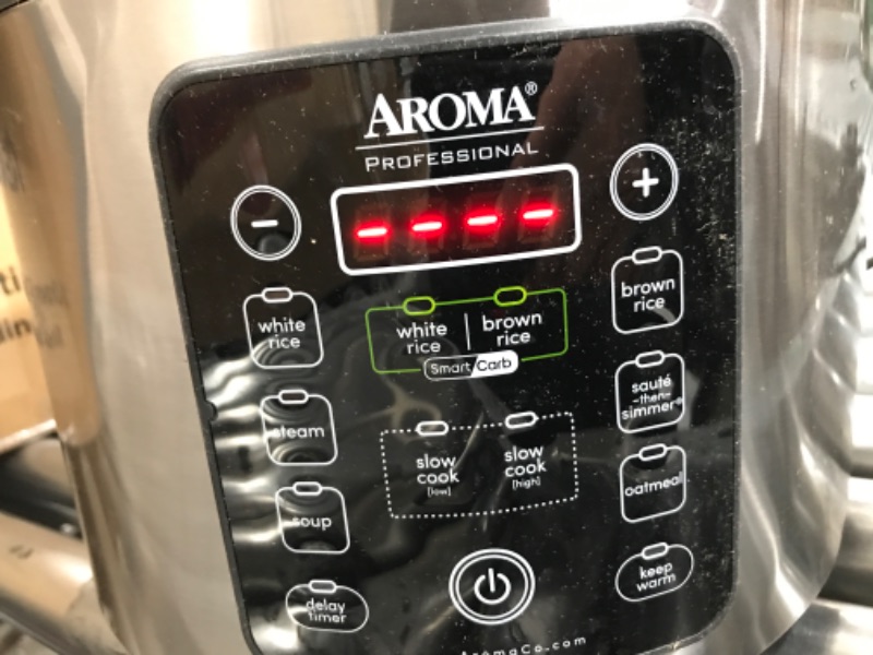 Photo 2 of ***TESTED/ TURNS ON// DENTED*** Aroma Housewares ARC-1120SBL SmartCarb Cool-Touch Stainless Steel Rice Multicooker Food Steamer, Slow Cooker with Non-Stick Inner Pot and Steam Tray, 20-Cup(cooked)/ 5Qt, Black Smart Carb