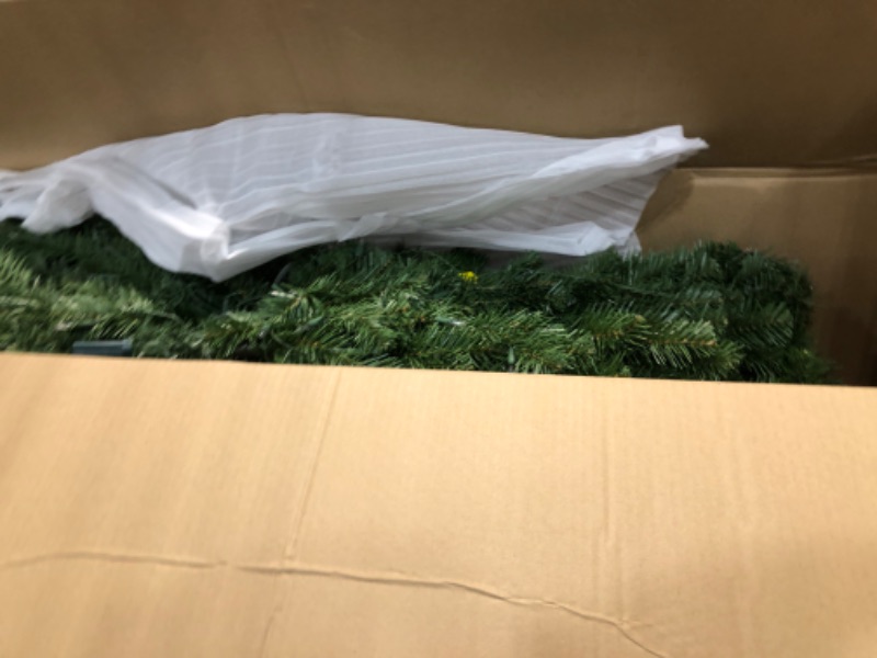 Photo 2 of **USED** National Tree Company Pre-Lit Artificial Slim Christmas Tree, Green, North Valley Spruce, White Lights, Includes Stand, 9 Feet 9 ft