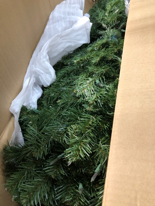 Photo 5 of **USED** National Tree Company Pre-Lit Artificial Slim Christmas Tree, Green, North Valley Spruce, White Lights, Includes Stand, 9 Feet 9 ft