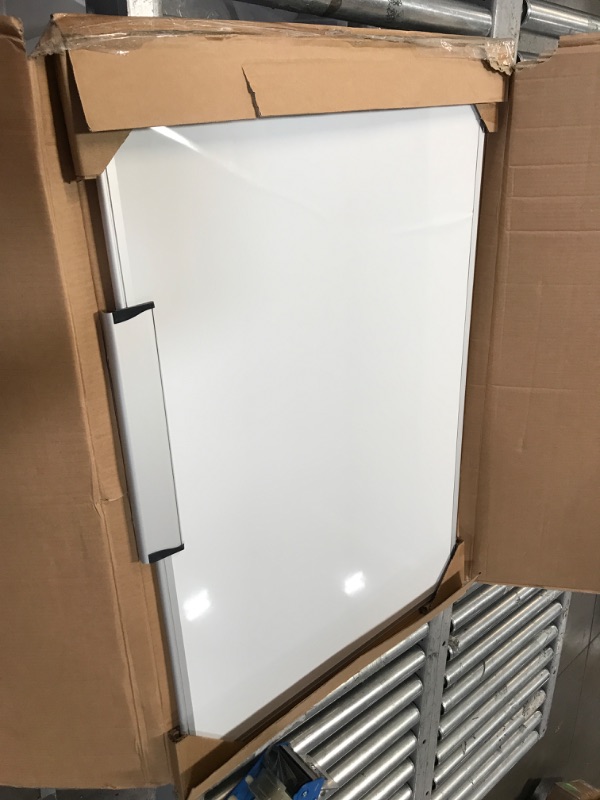 Photo 2 of BENT BOARD; MISSING ACCESSORIES**Amazon Basics Magnetic Dry Erase White Board, 36 x 24-Inch Whiteboard - Silver Aluminum Frame 24" x 36" Magnetic, Aluminum Frame