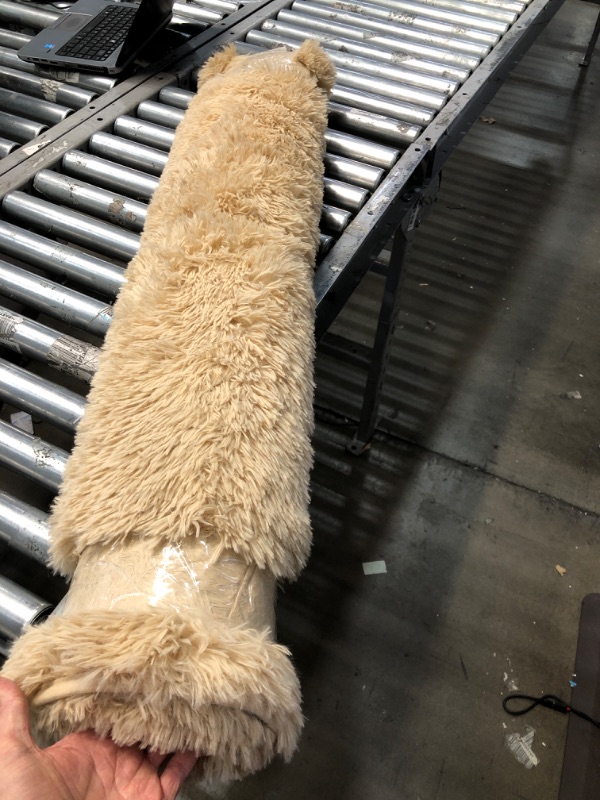Photo 1 of **USED** Medium Sized Light Brown Fluffy Rug/Mat, unspecified dimensions 