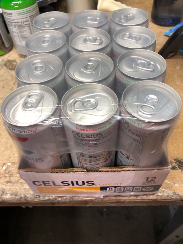 Photo 2 of **NEW/FACTORY SEALED**  CELSIUS Peach Mango Green Tea, Functional Essential Energy Drink 12 Fl Oz (Pack of 12) Peach Mango Green Tea 12 Fl Oz (Pack of 12) Expiration Date: 04/2024