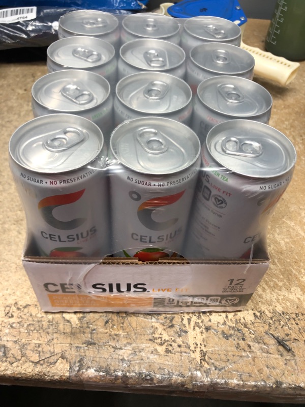 Photo 2 of **NEW/FACTORY SEALED**  CELSIUS Peach Mango Green Tea, Functional Essential Energy Drink 12 Fl Oz (Pack of 12) Peach Mango Green Tea 12 Fl Oz (Pack of 12) Expiration Date: 04/2023