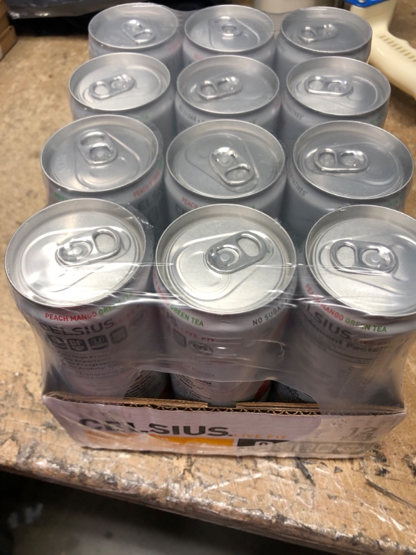 Photo 2 of **NEW/FACTORY SEALED**  CELSIUS Peach Mango Green Tea, Functional Essential Energy Drink 12 Fl Oz (Pack of 12) Peach Mango Green Tea 12 Fl Oz (Pack of 12) Expiration Date: 04/2024