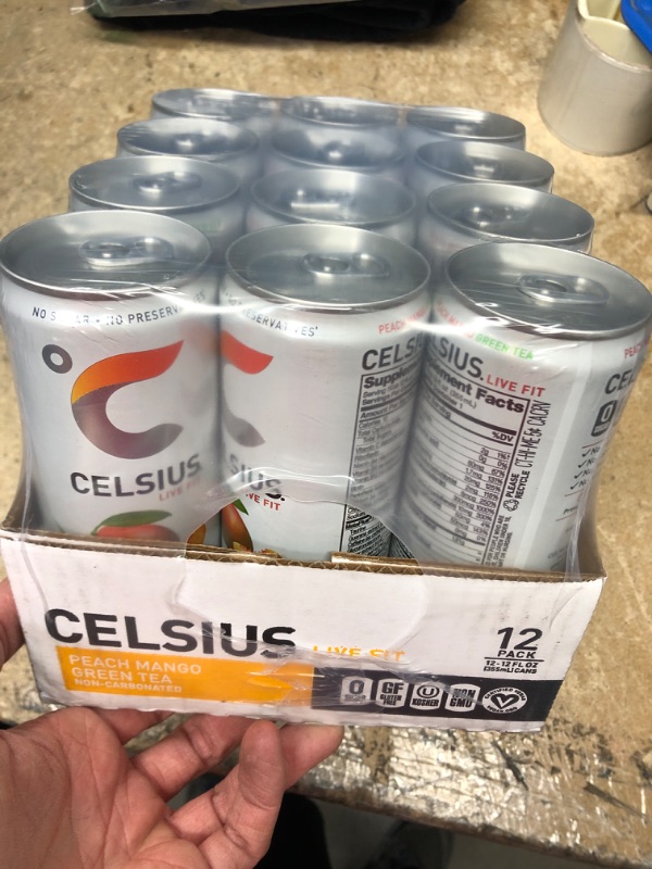 Photo 2 of **NEW/FACTORY SEALED**  CELSIUS Peach Mango Green Tea, Functional Essential Energy Drink 12 Fl Oz (Pack of 12) Peach Mango Green Tea 12 Fl Oz (Pack of 12) Expiration Date: 04/2024