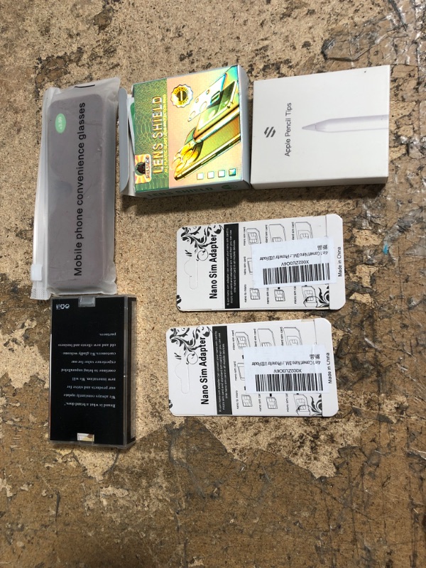 Photo 2 of 10 assorted items apple pencil, nano sim adapter , mobile phone convenience glasses, airtag protector, and misc.