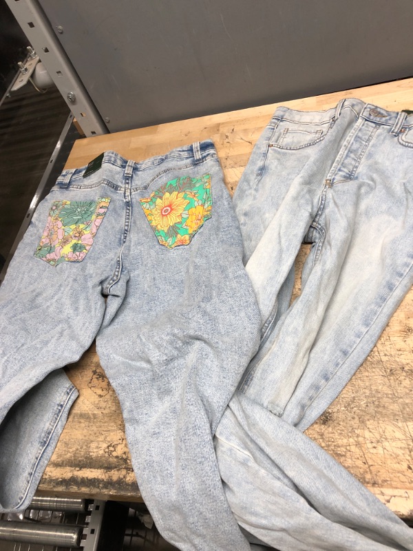 Photo 1 of 2 PAIRS OF JEANS 
