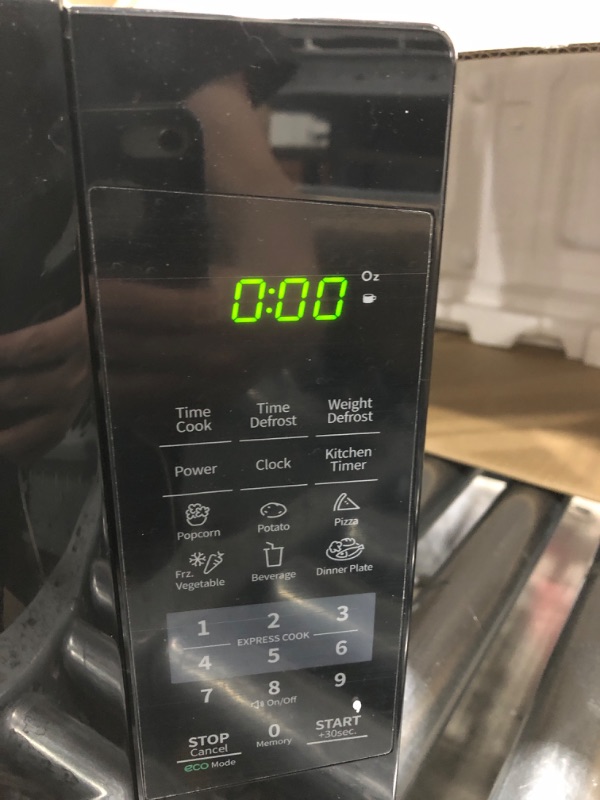 Photo 2 of **TESTED/ TURNS ON** COMFEE' EM720CPL-PMB Countertop Microwave Oven with Sound On/Off, ECO Mode and Easy One-Touch Buttons, 0.7cu.ft, 700W, Black Black Microwave