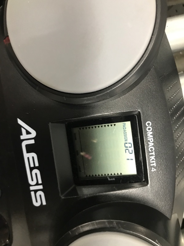 Photo 1 of Alesis Compact Kit 4 – Tabletop Electric Drum Set with 70 Electronic / Acoustic Drum Kit Sounds, 4 Pads, Battery- or Ac-power and Drum Sticks Included