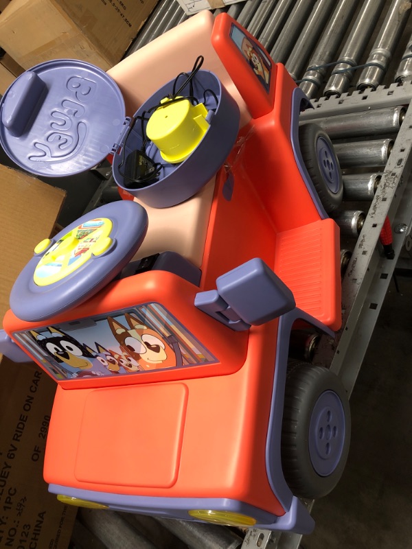 Photo 1 of Bluey 6V Ride On Car for Toddlers - Interactive Electric Car for Kids with Sound Effects & Music, Riding Toy for Boys & Girls, Includes 6V Rechargeable Battery & Charger
