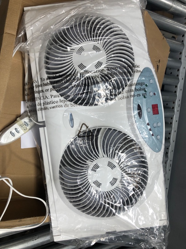 Photo 2 of Used / non functional *** Bionaire Window Fan with Twin 8.5-Inch Reversible Airflow Blades and Remote Control, White White 2 Blades Electronic control with LCD screen Window Fan