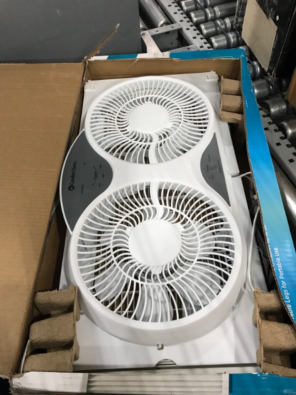 Photo 2 of **USED**   Comfort Zone CZ310R Adjustable Width 3 Speed Dual Reversible Multi Functional Window Sill Fan with Remote Control and Removable Cover, White