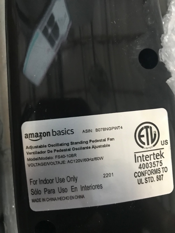 Photo 1 of USED. PARTS ONLY. Amazon Basics Oscillating Dual Blade Standing Pedestal Fan with Remote - 16-Inch