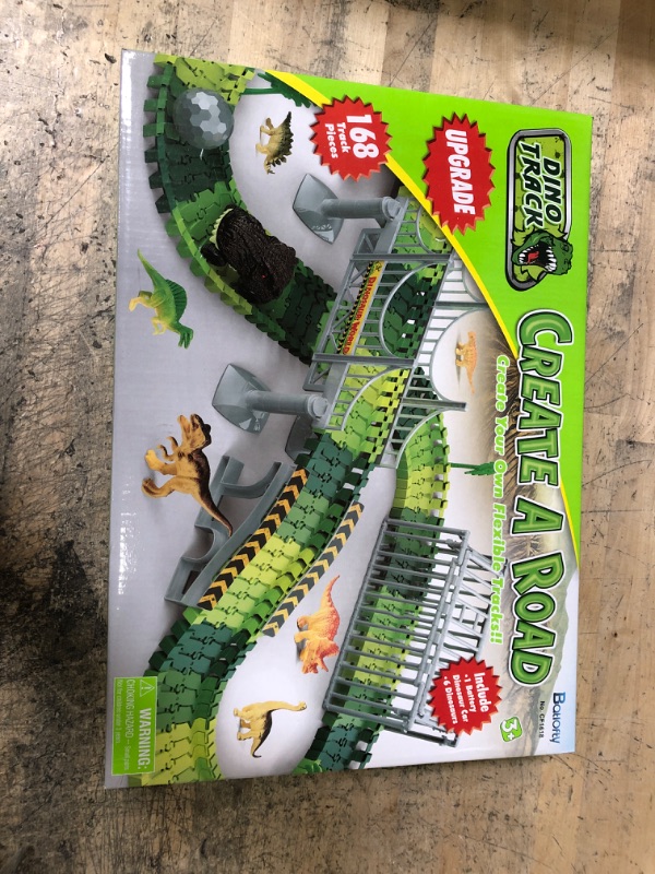 Photo 2 of Batlofty Dinosaur Toys Race Track, Flexible Track Playset, Create A Dinosaur World Road Race with 1 Dinosaur Car and 6 Dinosaur Toys for 3 4 5 6 7 Year Old Boys Girls Birthday Gifts Dinosaur Race Track