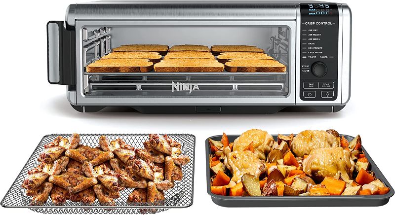 Photo 1 of "FOR PARTS" "DOES NOT TURN ON AND DAMAGED" Ninja SP101 Digital Air Fry Countertop Oven with 8-in-1 Functionality, Flip Up & Away Capability for Storage Space, with Air Fry Basket, Wire Rack & Crumb Tray, Silver