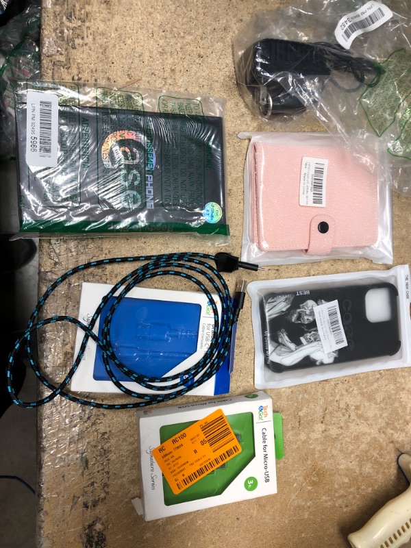 Photo 1 of **USED** Bundle of 2 Phone Cases, 2 USB Cables, 1 Passport Wallet, and 1 Power Adapter