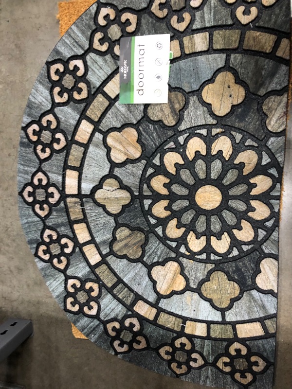 Photo 2 of **back of mat has 5-6" vertical tear***
23x35  Floral Half-circle Doormat Black - Mohawk