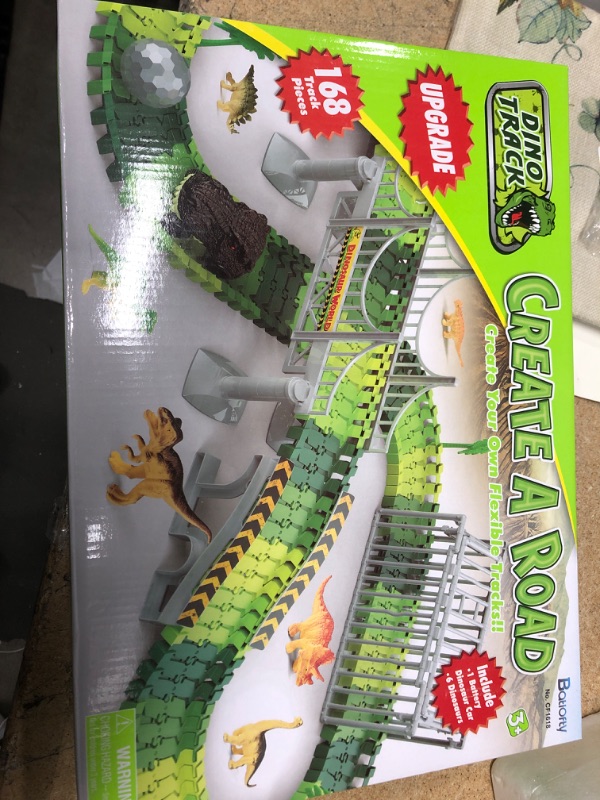 Photo 2 of Batlofty Dinosaur Toys Race Track, Flexible Track Playset, Create A Dinosaur World Road Race with 1 Dinosaur Car and 6 Dinosaur Toys for 3 4 5 6 7 Year Old Boys Girls Birthday Gifts Dinosaur Race Track