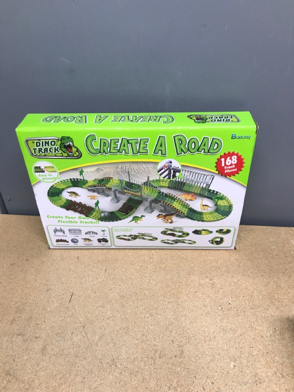 Photo 2 of Batlofty Dinosaur Toys Race Track, Flexible Track Playset, Create A Dinosaur World Road Race with 1 Dinosaur Car and 6 Dinosaur Toys for 3 4 5 6 7 Year Old Boys Girls Birthday Gifts Dinosaur Race Track