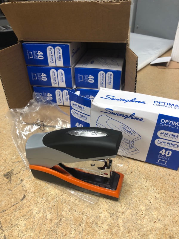 Photo 1 of Swingline Stapler, Half Strip Desktop Stapler, 40 Sheet Capacity, Low Force, Compact Size, Office, Desk, Optima 40, Orange/Silver/Black, 6 Pack (87842) (S7087842-CS)