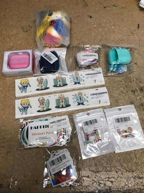 Photo 1 of Assortment of stickers, airpod cases, squishies squeeze toy, iron on patch letters. 