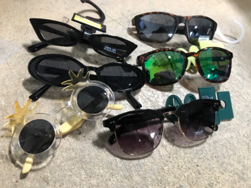 Photo 1 of ASSORTED SUN GLASSES