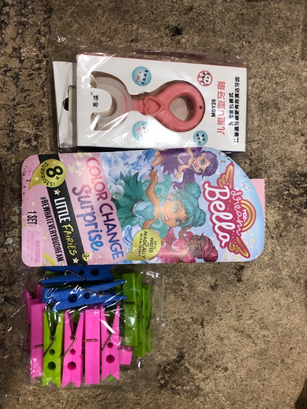 Photo 1 of 10 assorted items, teething helper, headband, fidget toy, dream bella, clothe plastic clip holders, and misc