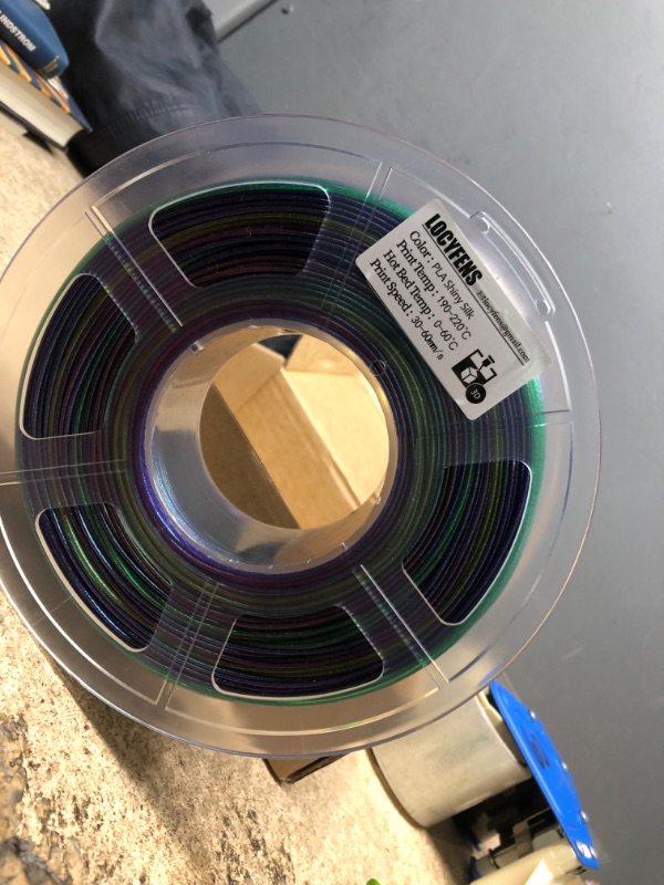 Photo 2 of LOCYFENS Rainbow PLA Filament 1.75mm, 3D Printer Filament Multicolor PLA Filament, Color Change Shiny PLA Filament 1.75mm, 3D Printing Filament 1kg/2.2lb Shiny Rainbow