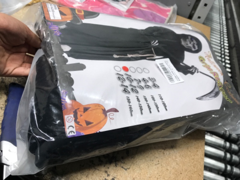 Photo 2 of **SEE NOTES**
Grim Reaper Halloween Costume for Kids Scream Costume with Light Up Red Eyes 10-12 Years