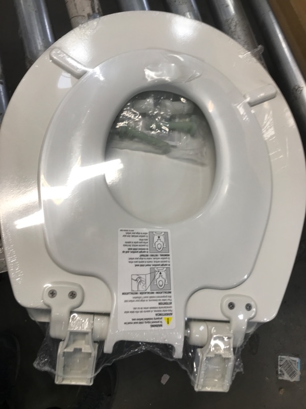 Photo 2 of **FACTORY  SEALED**  MAYFAIR 888SLOW 000 NextStep2 Toilet Seat with Built-In Potty Training Seat, Slow-Close, Removable that will Never Loosen, ROUND, White Round White