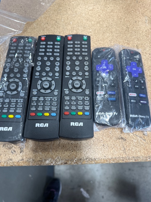 Photo 1 of Bundle of assorted RCA and RCA Roku TV remotes, 5 remotes.