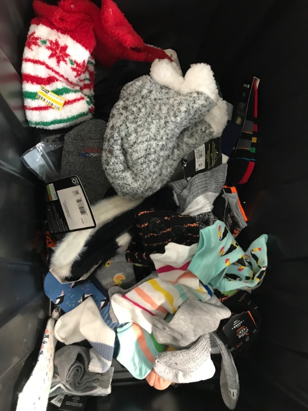 Photo 1 of bundle of socks for kids. sizes in between 4-10