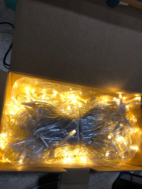 Photo 1 of Ollny Icicle Christmas Lights Outdoor, Icicle Lights 594LED 49ft Connectable Hanging Fairy String Lights with 99 Drops, 8 Modes Remote Clear Wire Curtain Ice Lights Indoor Decorations (Warm White)
