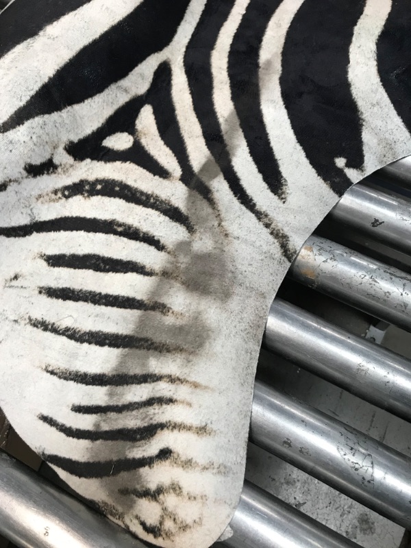 Photo 3 of **DIRTY FROM SHIPPING**jinchan Zebra Print Area Rug Faux Skin Cowhide Animal Design Mat Faux Suede Safari Rug Indoor Floorcover for Bedroom Living Room 5x7 Safari Design 5'1" x 6'3" Black,white