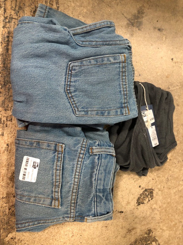 Photo 1 of 10 assorted kid jean pants, beach shirt, baby socks, and shirt