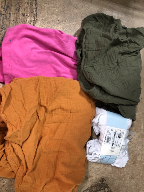 Photo 1 of 10 assorted kid jean pants, beach shirt, baby socks, and shirt