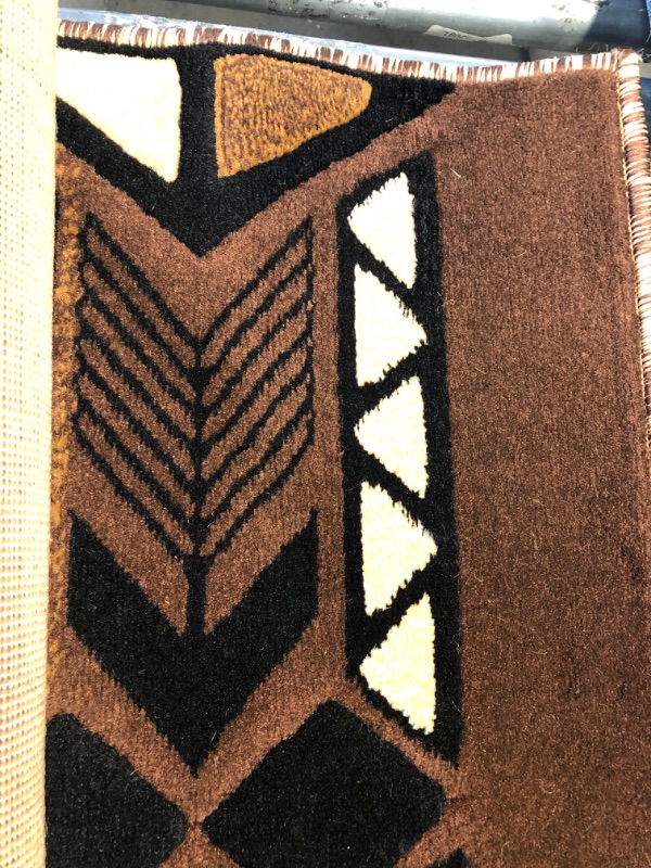 Photo 2 of  brown area rug 5' x 8'