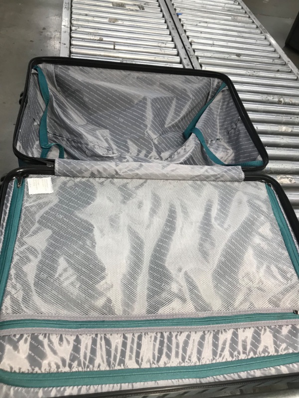 Photo 2 of *** used has minor hole see pictures *** U.S. Traveler Boren Polycarbonate Hardside Rugged Travel Suitcase Luggage with 8 Spinner Wheels, Aluminum Handle, Teal, Checked-Large 30-Inch
