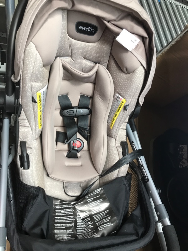 Photo 2 of **MISSING PARTS** SEE NOTES**
***BABY CAR SEAT AND STROLLER ONLY***
Evenflo Pivot Modular Travel System With SafeMax Car Seat- Sandstone Beige