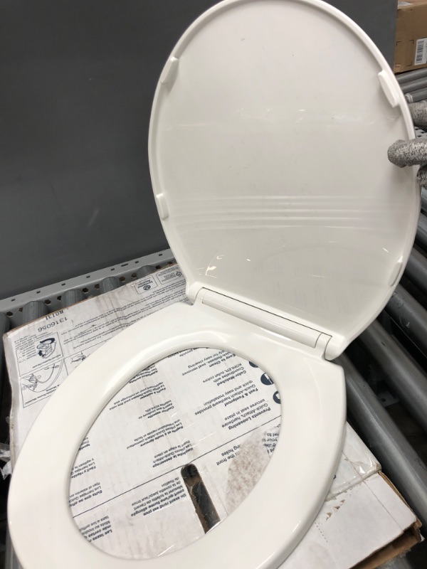 Photo 7 of **PARTS ONLY**
Kohler 4775-0 Brevia Round Toilet Seat with Grip Tight Bumpers, Release, Quick Attach Hardware, Color Matched Hinges, White Round White

**MISSING PARTS AND HARDWARE **