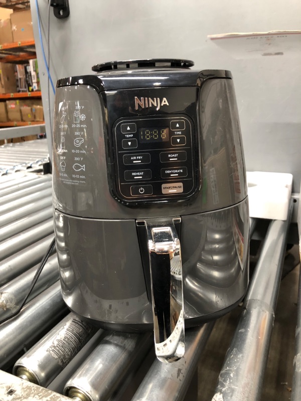 Photo 4 of ***non-functional*** Ninja AF101 Air Fryer that Crisps, Roasts, Reheats, & Dehydrates, for Quick, Easy Meals, 4 Quart Capacity, & High Gloss Finish, Black/Grey 4 Quarts